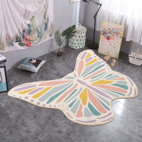 Lukinbox rug beside toys demonstrating 3x4 foot size and scale