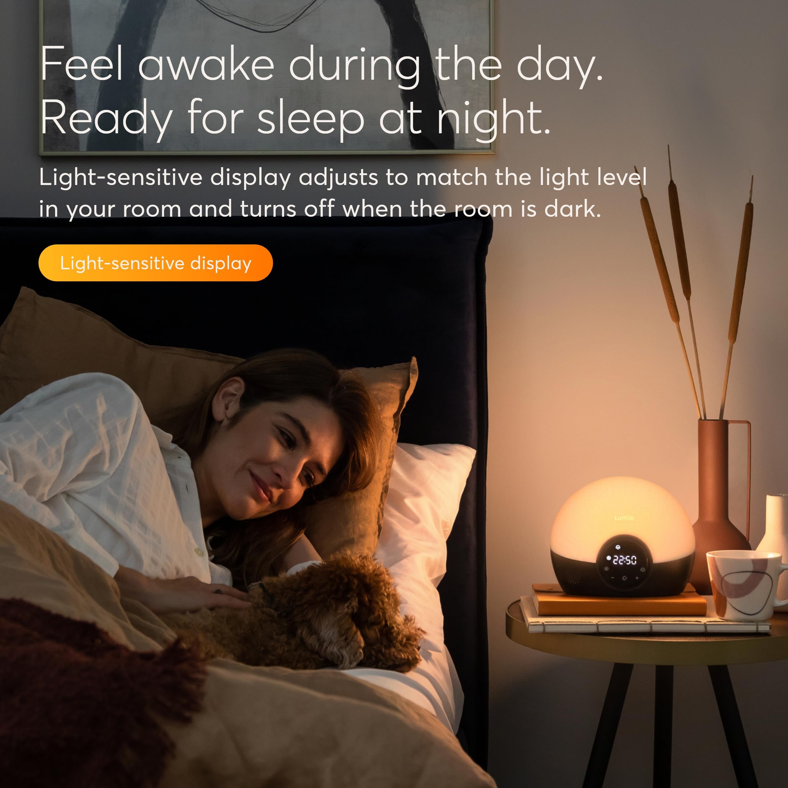 Lumie Bodyclock Glow 150 in reading mode illuminating a book with adjustable brightness benefit