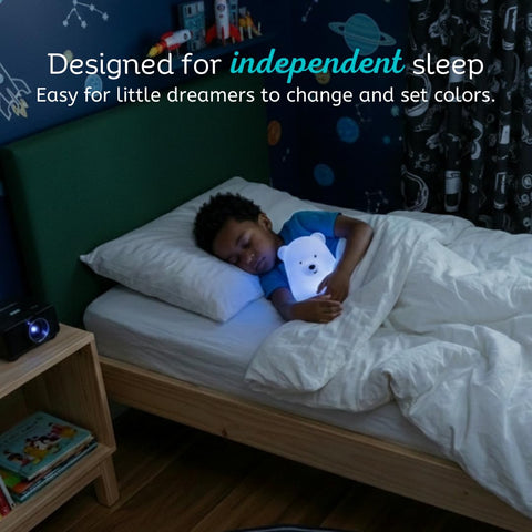 Lumipets bear on bedside table showing calming nursery lighting benefit