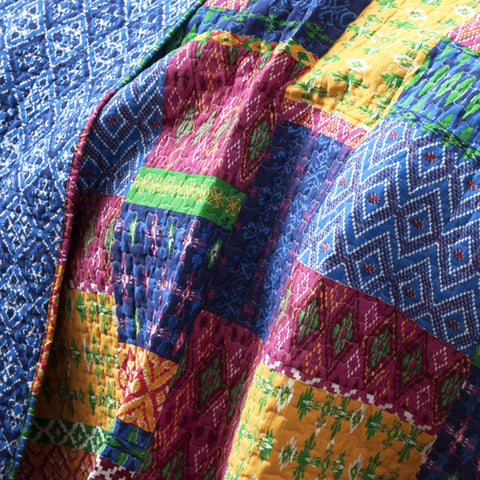 Lush Decor Misha quilt reverse close-up showing navy diamond pattern and versatility