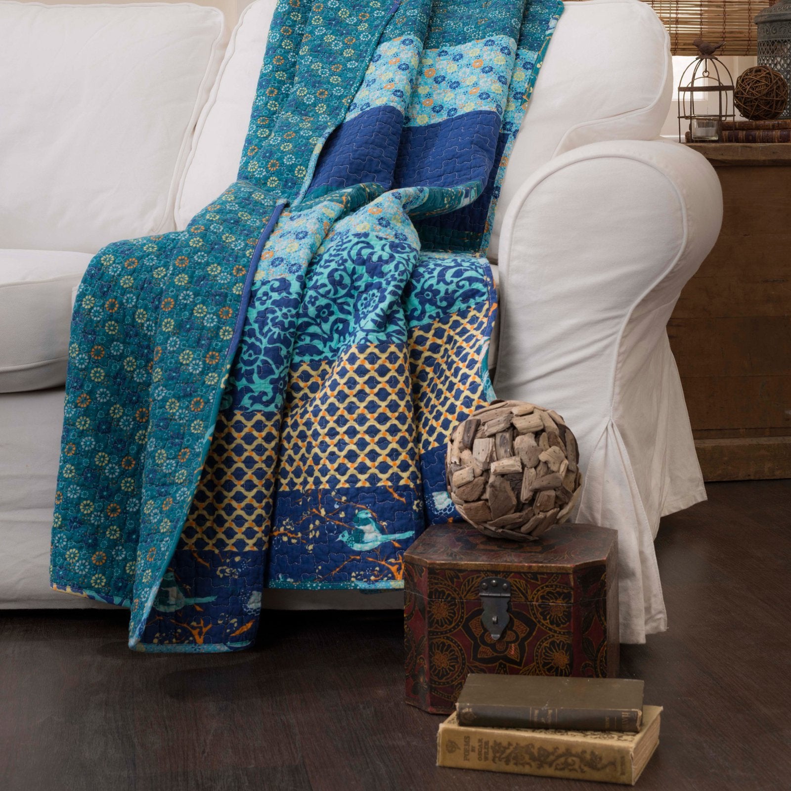 Lush Decor Royal Empire draped over a sofa in a living room, brings cozy boho style and layered color