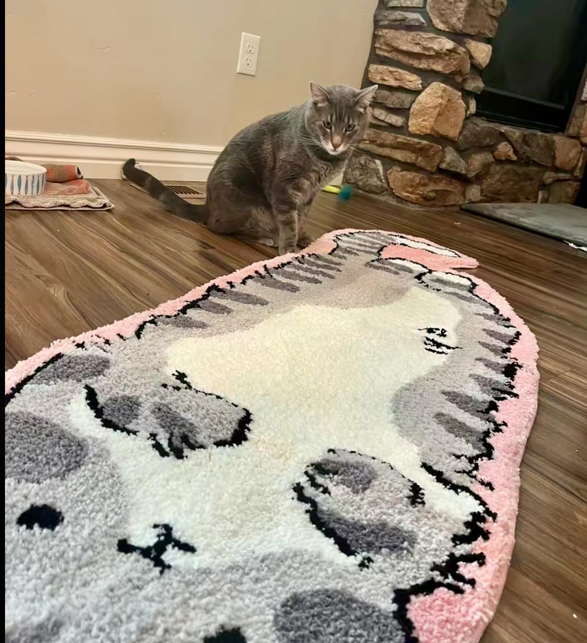 Luxape rug beside chair showing scale and how it accents furniture