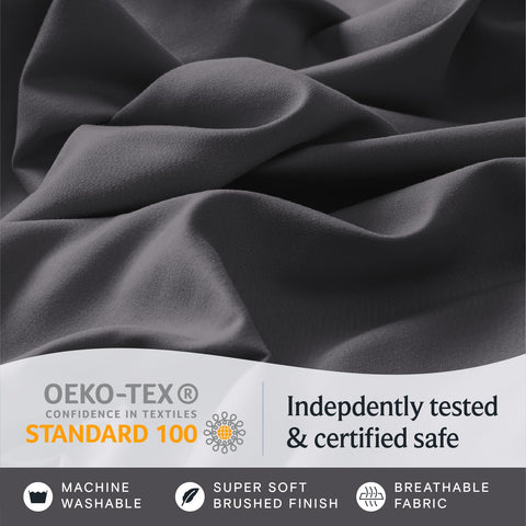 Close-up of LuxClub Oeko-Tex tag and care label indicating tested fabric safety and easy maintenance