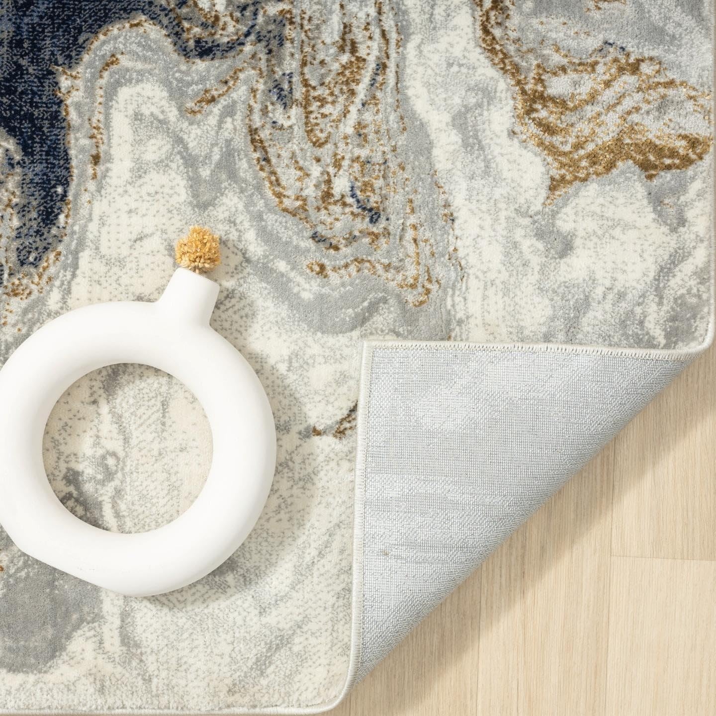 LUXE WEAVERS rug edge and label detail highlighting weave quality and durability