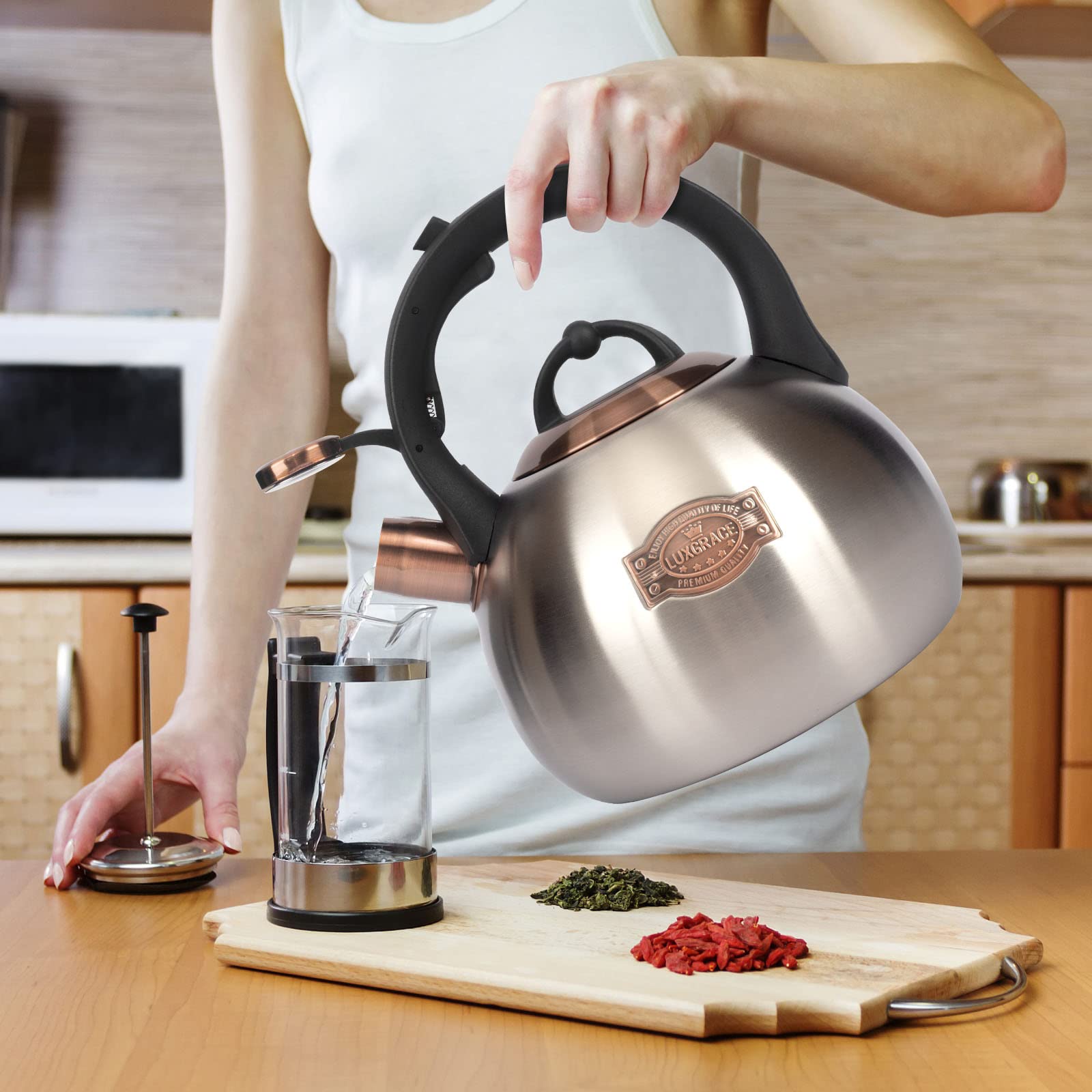 LUXGRACE kettle on induction stovetop showing compatibility with modern cooktops