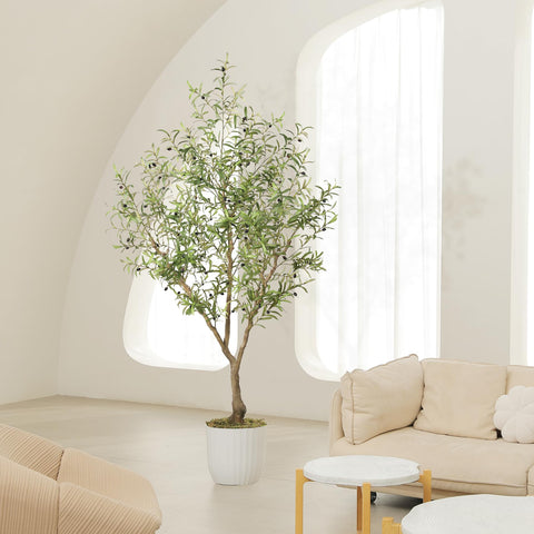 LYERSE faux olive tree styled in living room adding height and calming atmosphere benefit