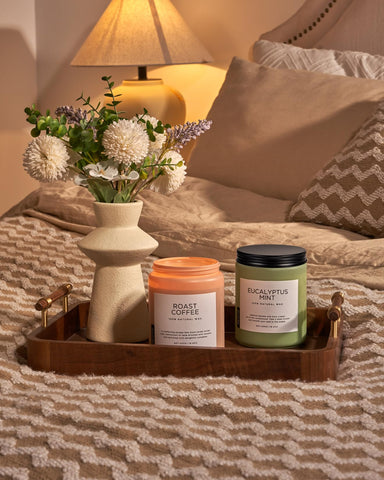 M&SENSE candle on coffee table creating warm inviting atmosphere