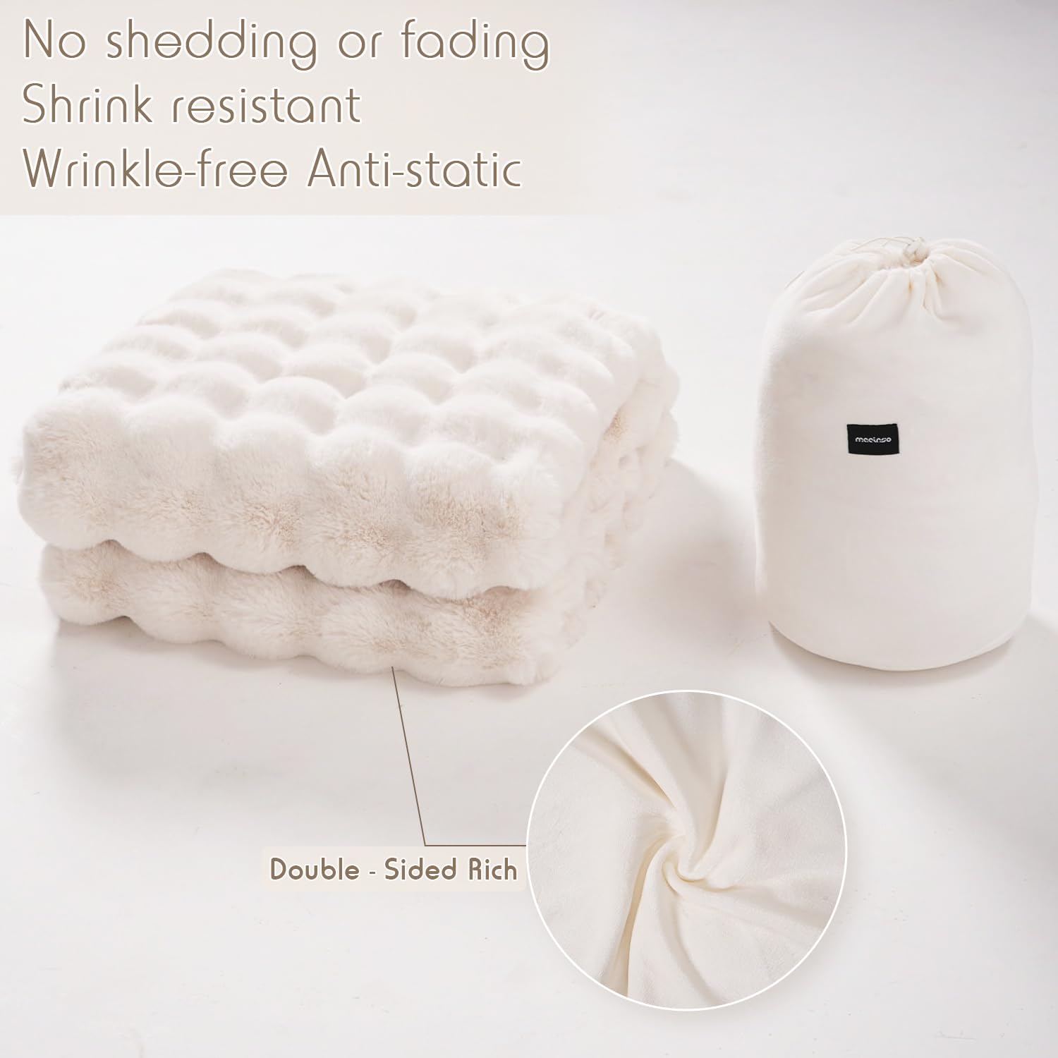 macinso blanket next to chair showing scale and generous 50x60 inch coverage