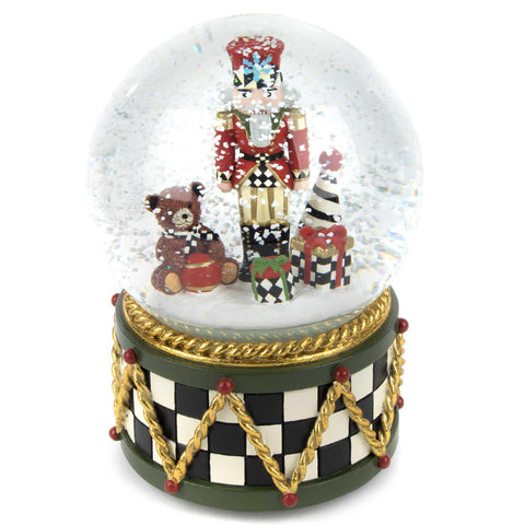 MACKENZIE-CHILDS nutcracker snow globe front view shows festive display and collectible appeal