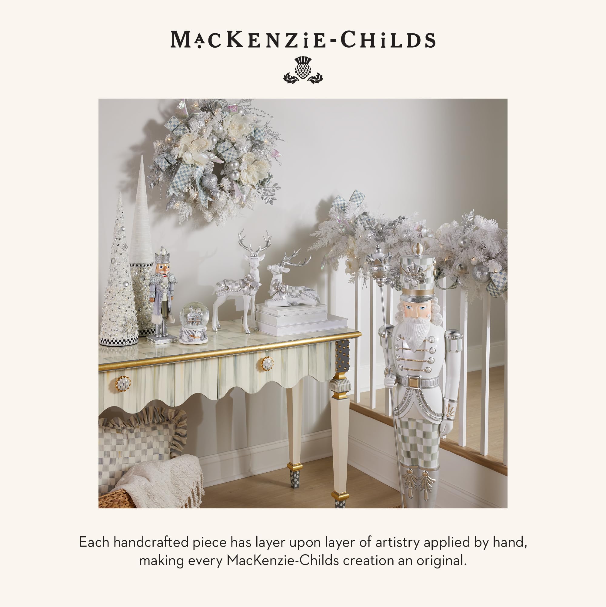 MACKENZIE-CHILDS scale comparison with hand showing compact display size