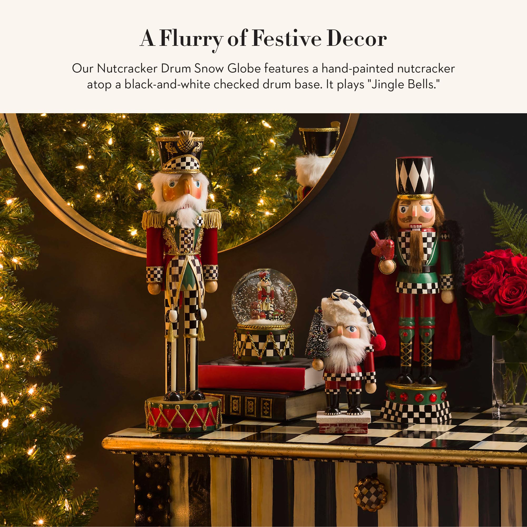 MACKENZIE-CHILDS close-up of nutcracker, teddy bear, and tiny gifts inside globe highlights fine detail