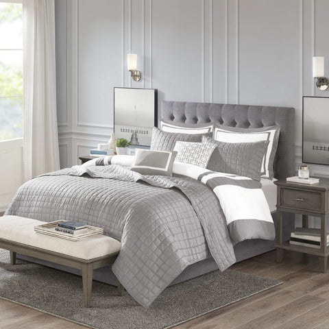Madison Park styled bedroom with set on king bed demonstrating hotel-inspired elegance