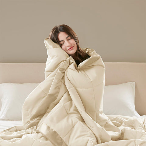 Madison Park blanket in use with person reading showing cozy comfort