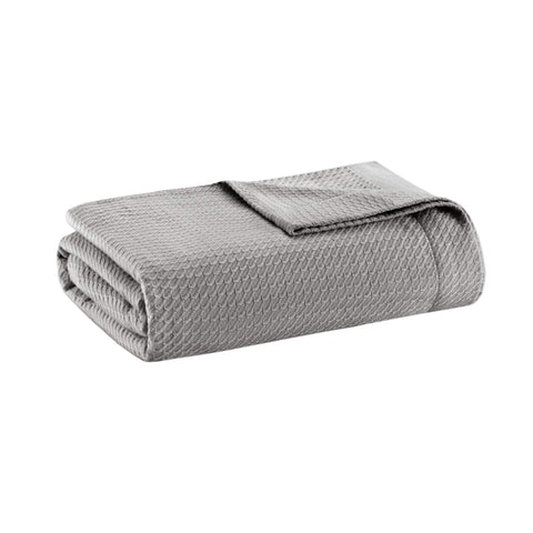 Madison Park front view of grey blanket highlighting soft finish and styling benefit