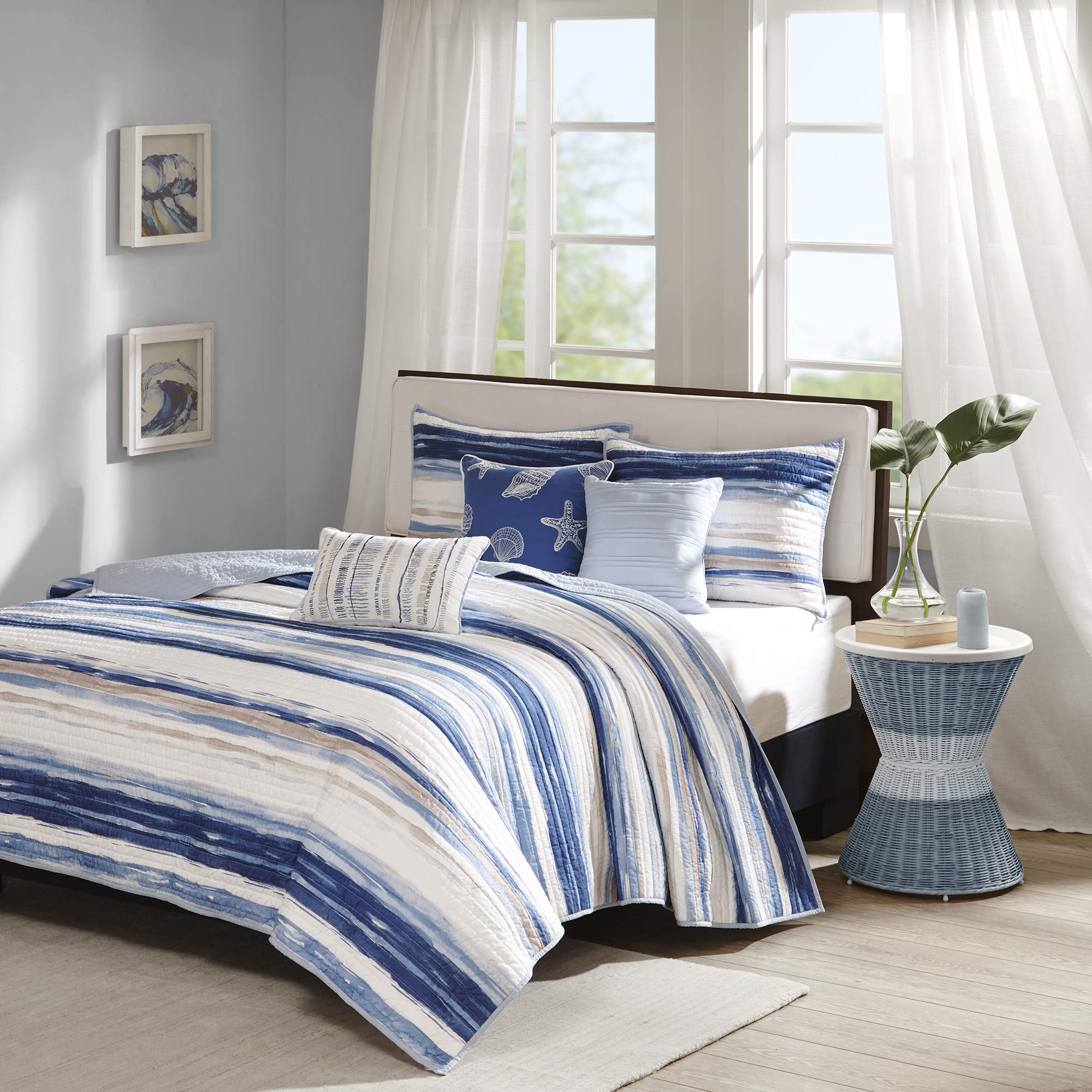Madison Park front coverlet showing watercolor coastal stripes and airy drape benefit