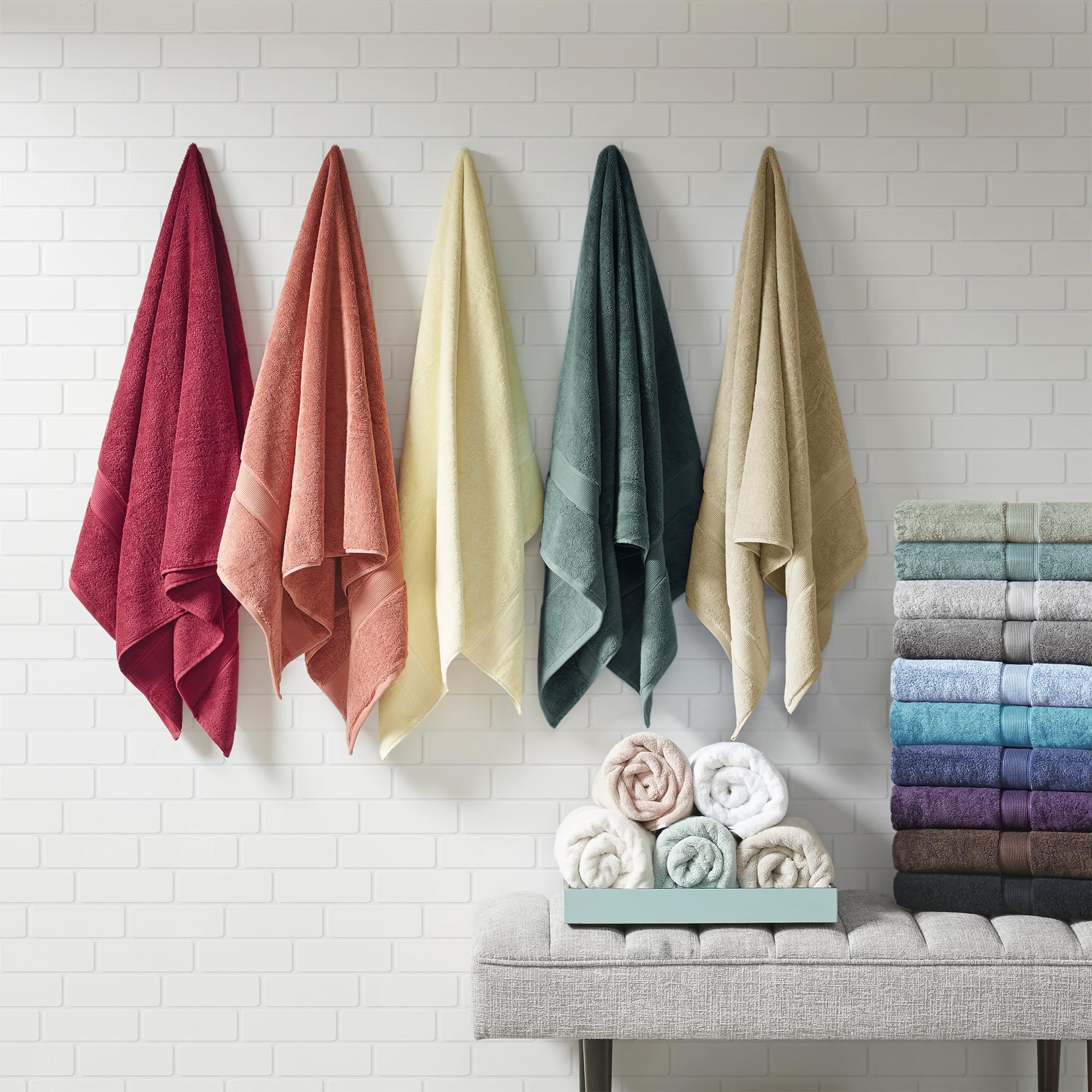 Madison Park size comparison display of bath towel and hand towel showing generous dimensions for coverage