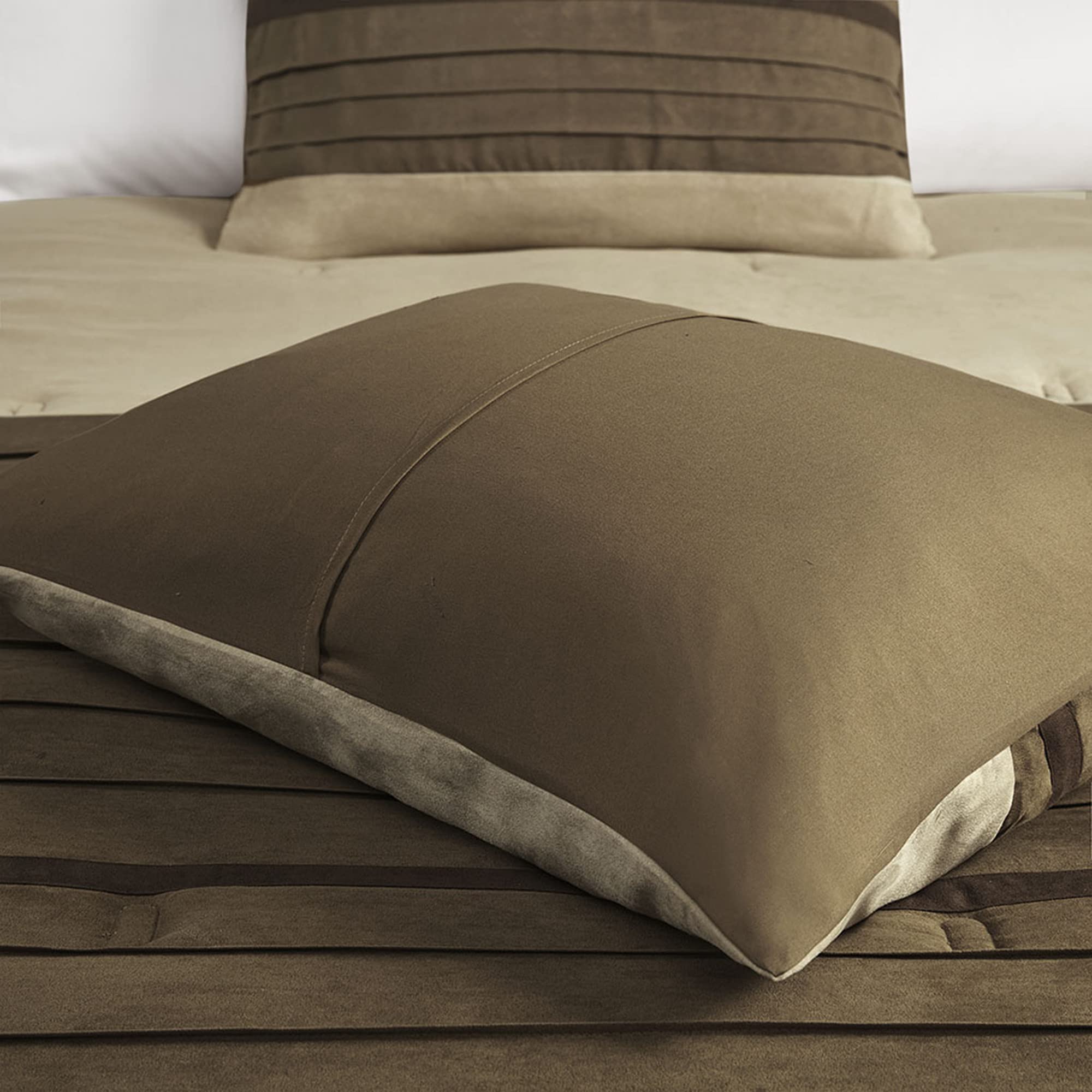 Madison Park comforter size scale beside ruler to show true queen dimensions