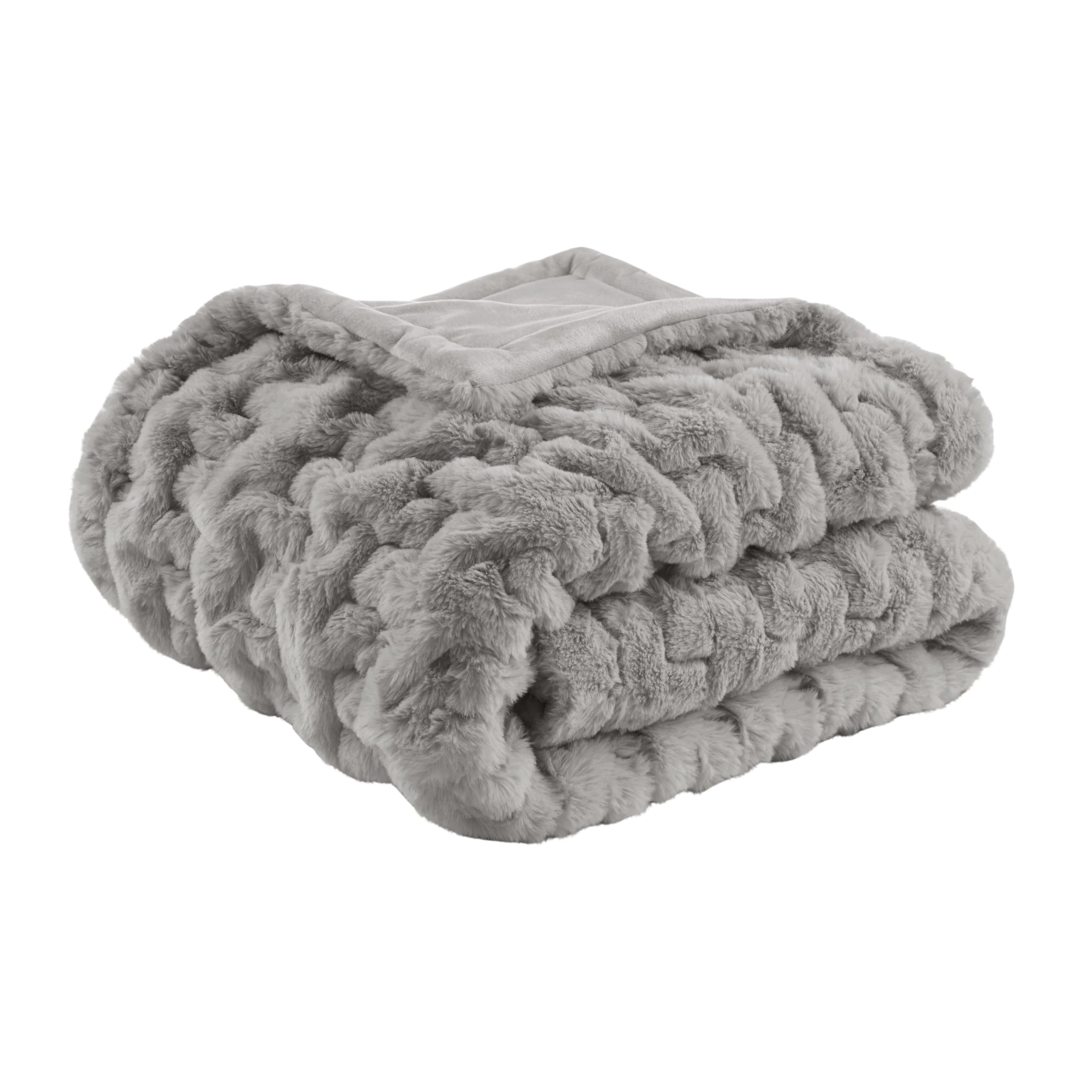 Madison Park throw front on sofa showing plush texture and stylish accent