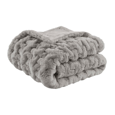 Madison Park throw front on sofa showing plush texture and stylish accent
