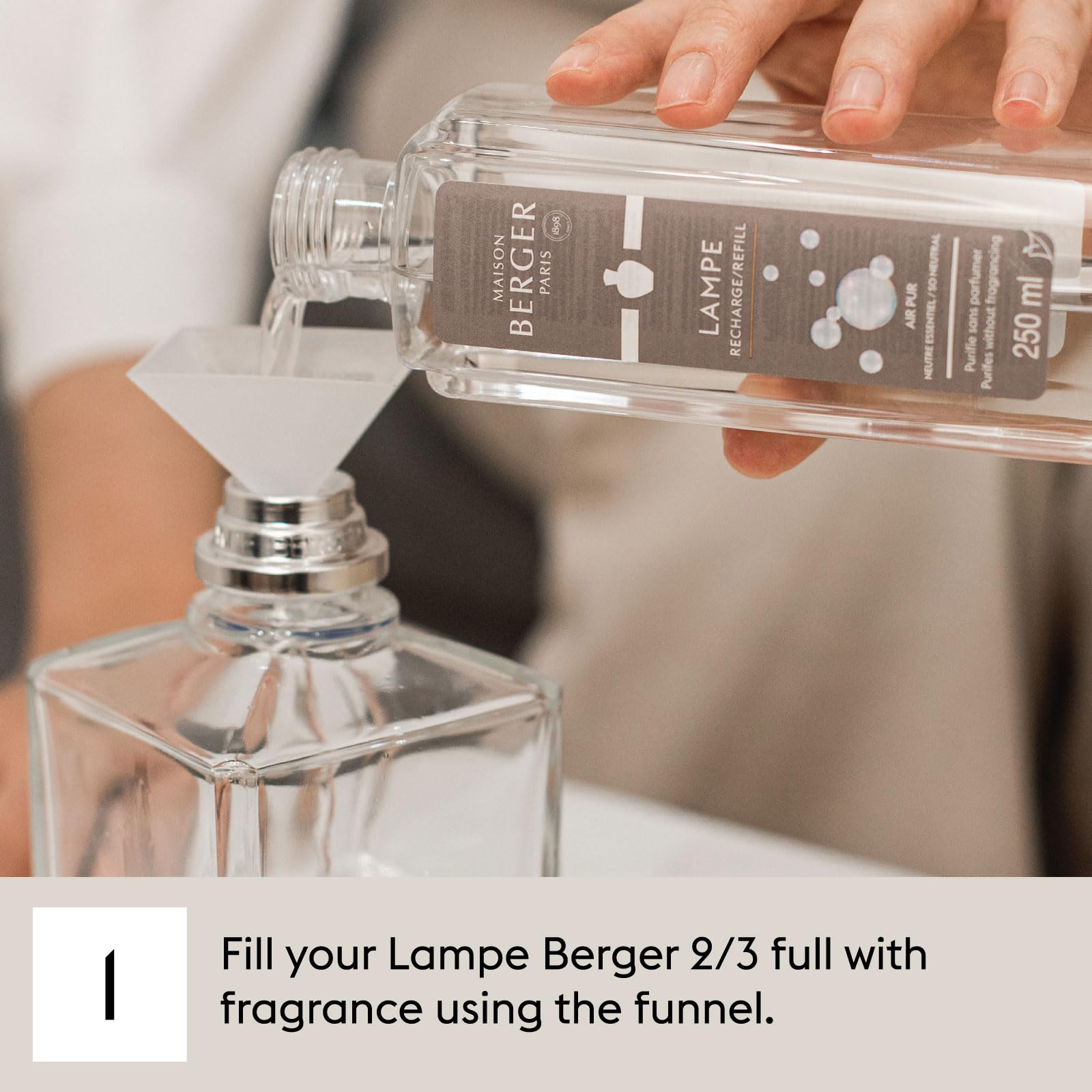 MAISON BERGER Charleston being poured into a Lampe Berger lamp demonstrating correct refill ritual