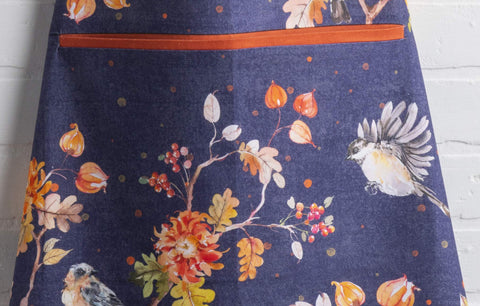 Maison d' Hermine apron worn at holiday table creating coordinated seasonal decor and charm