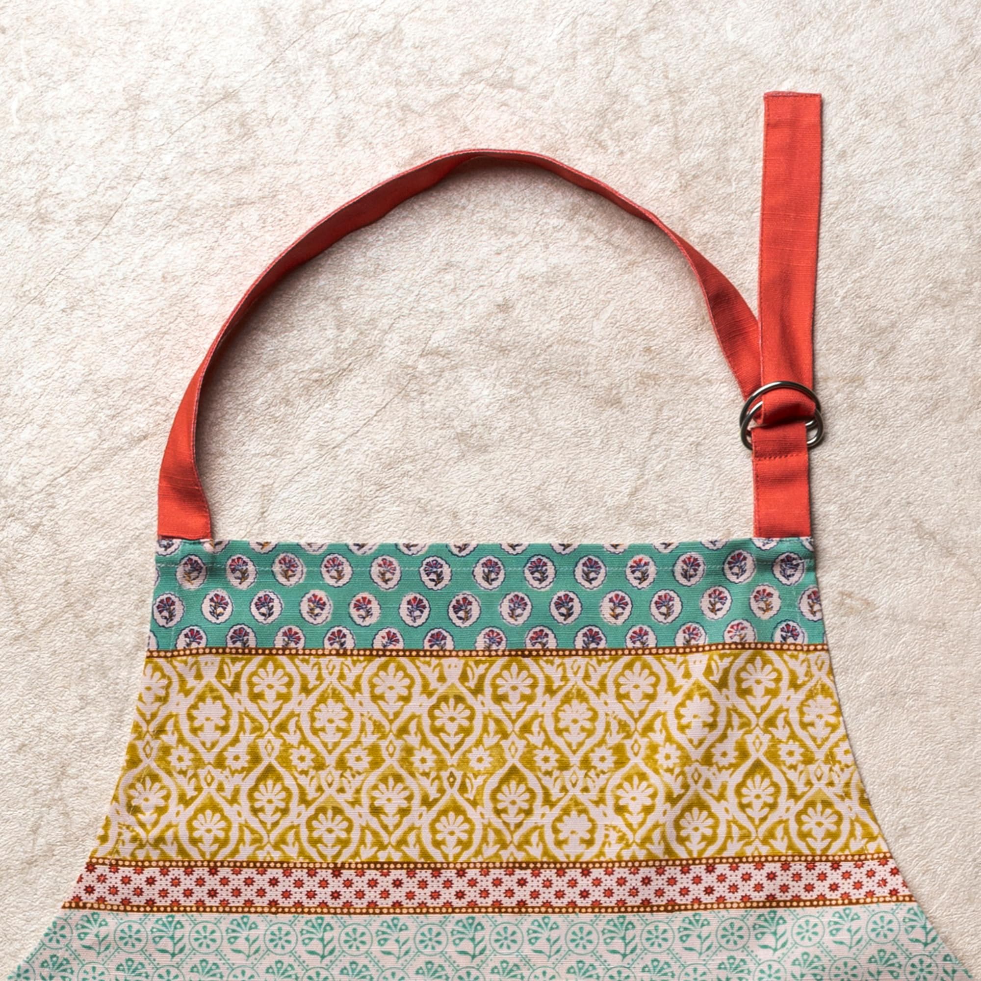 Maison d' Hermine apron beside utensils to show real-world size