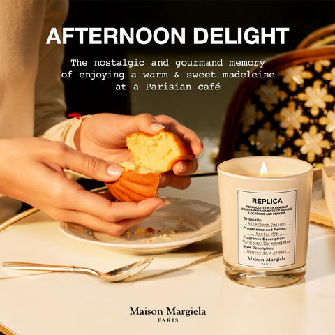 Maison Margiela candle held in hand showing 6.8 oz size for scale