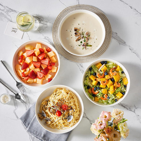 MALACASA hand holding bowl to show 48 oz capacity and family-sized serving advantage