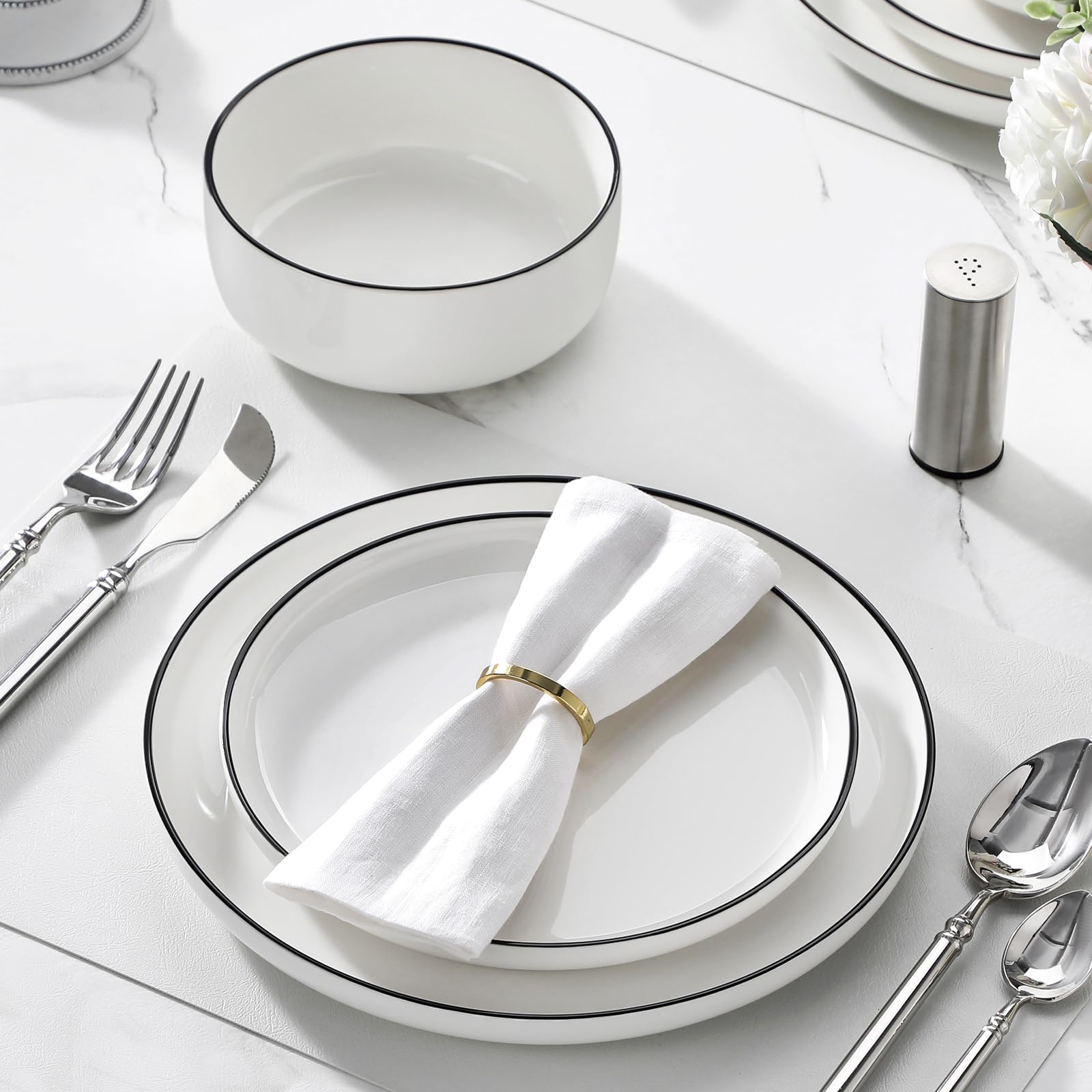 MALACASA neatly stacked plates in cupboard showing space-saving advantage