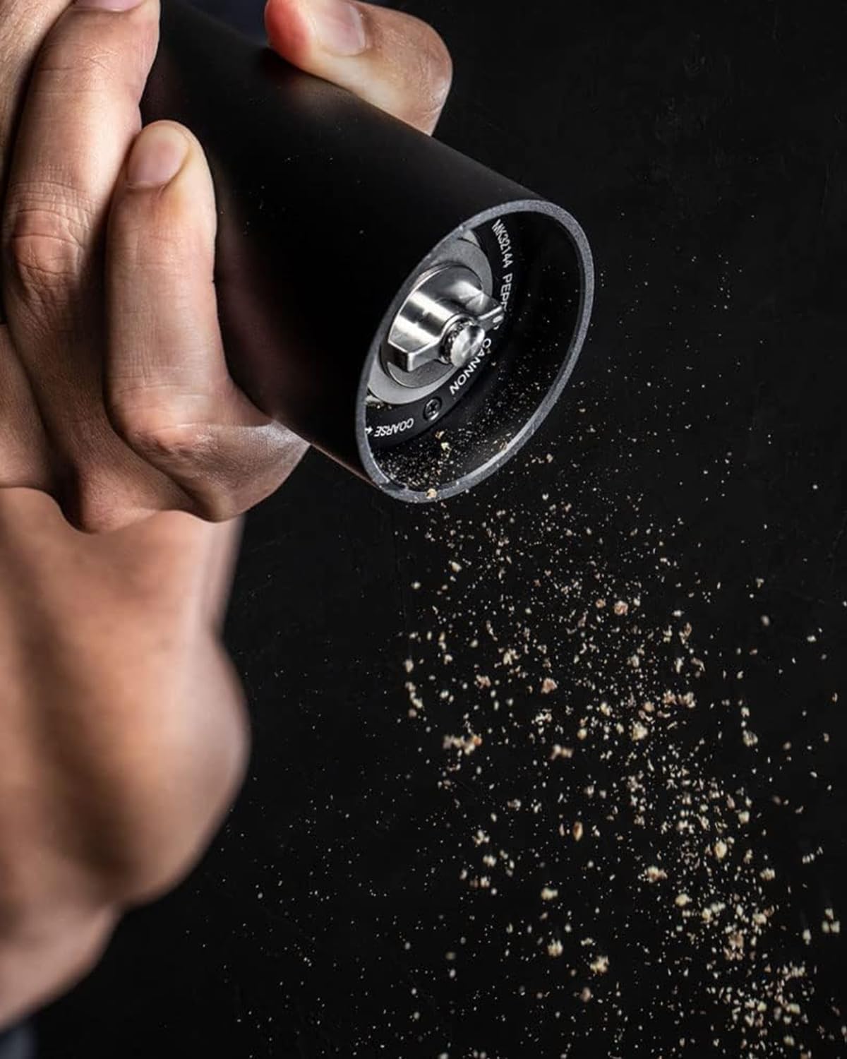 MANNKITCHEN Pepper Cannon hopper close-up with durable ceramic burrs for consistent grind
