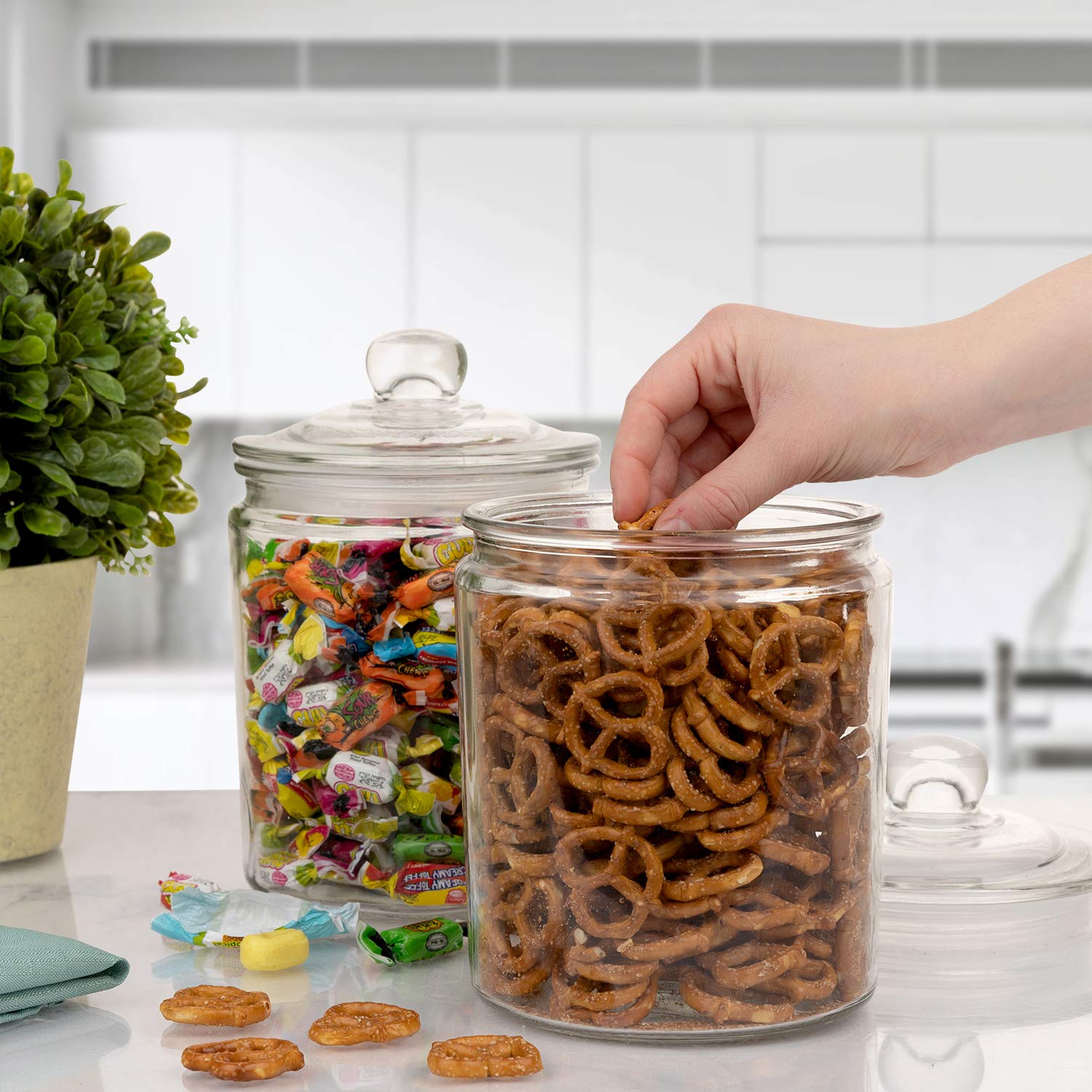 marbelous jars styled on kitchen counter organizing pasta cookies and snacks neatly