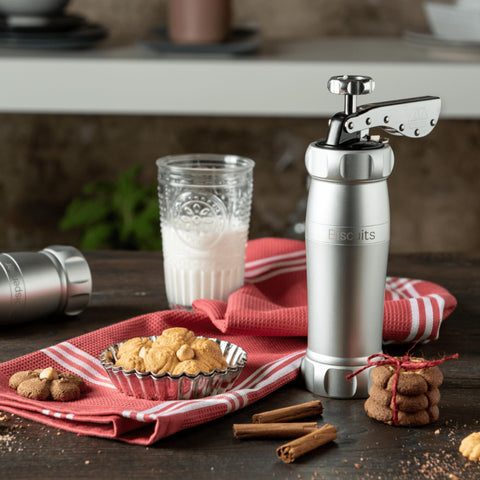 MARCATO cookie press held in hand to show scale and comfortable operation for home bakers