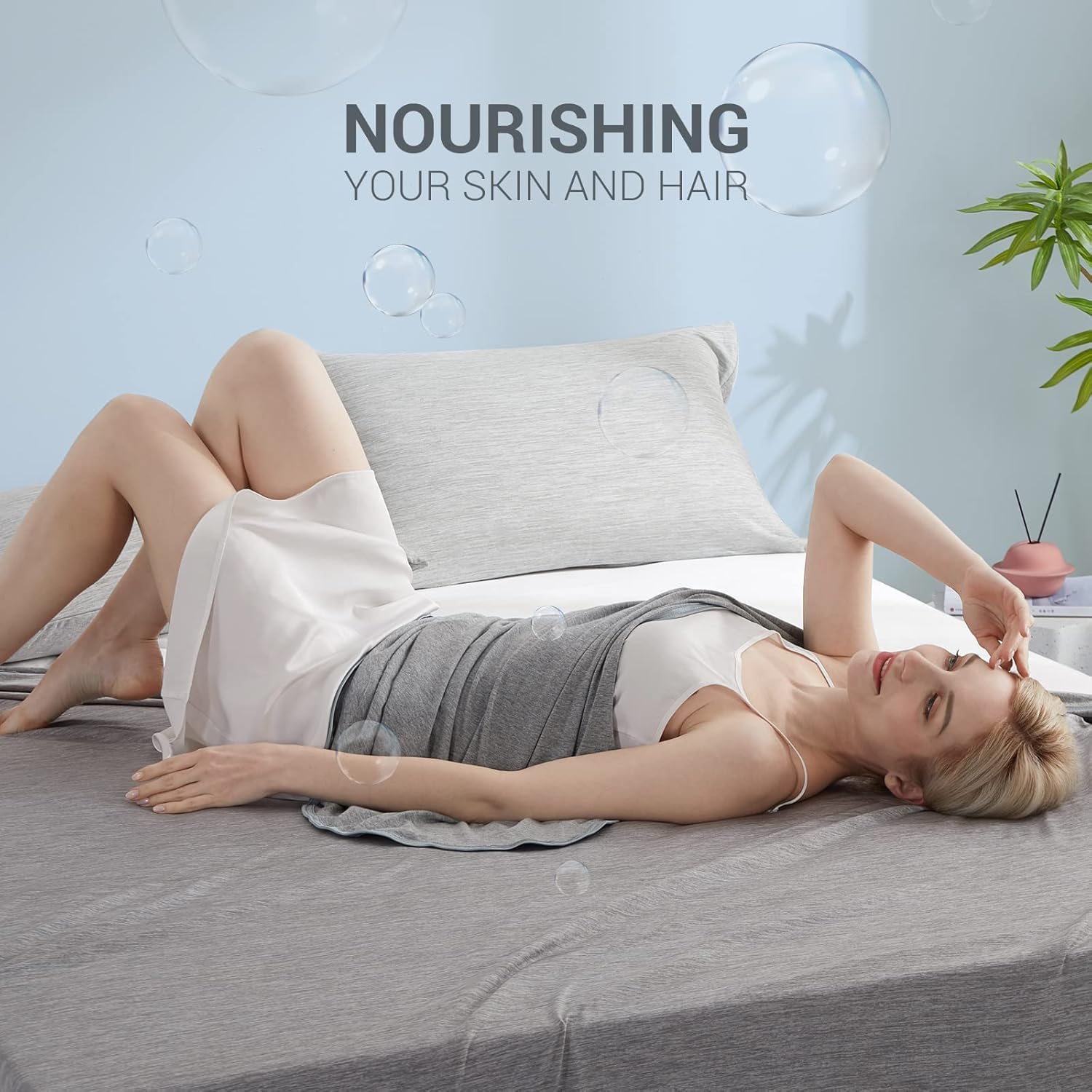 Marchpower blanket styled on queen bed in gray demonstrating cooler sleep and modern decor