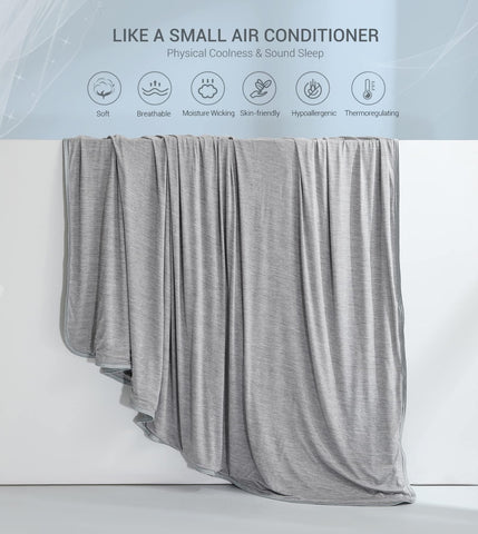 Marchpower folded blanket held to show lightweight portable size for travel convenience