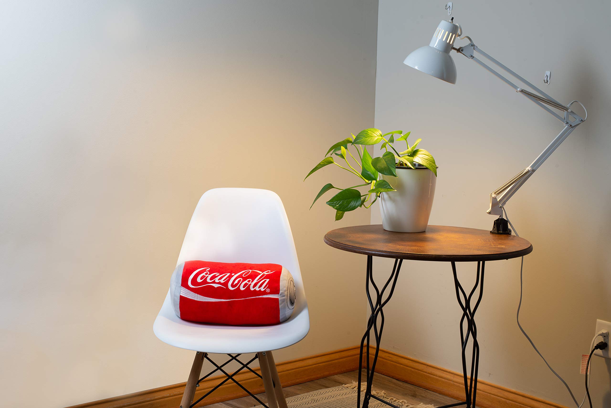 Mark Feldstein Coca-Cola pillow styled on sofa adding retro branding and visual interest to decor