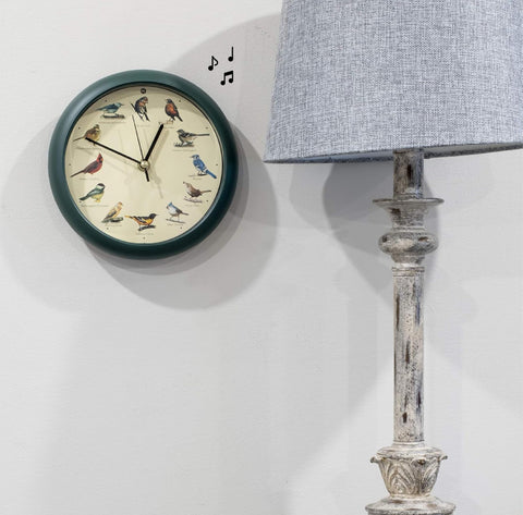 Mark Feldstein in kitchen wall display adding nature-themed decor and pleasant hourly cues