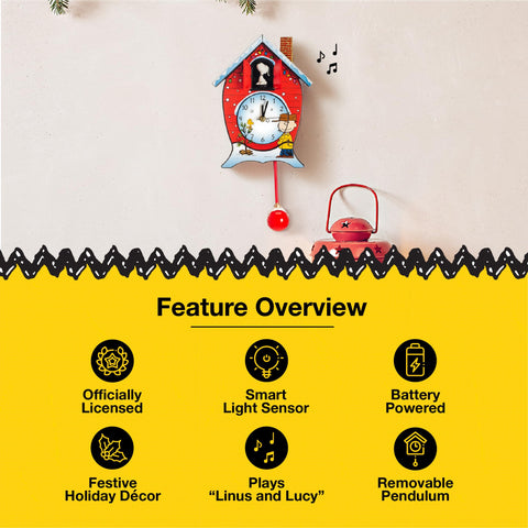 Mark Feldstein Peanuts clock beside hands showing 17-inch height for size reference