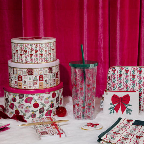 Martha Stewart tins displayed on kitchen shelf showing decorative storage in use