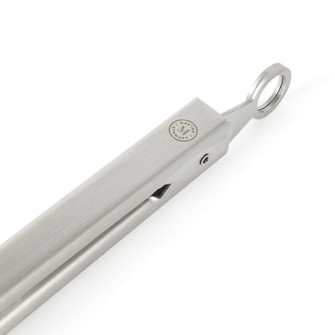 Martha Stewart tongs in hand showing secure grip for flipping and serving