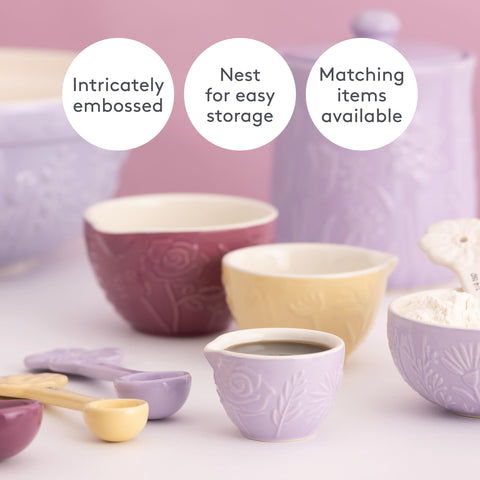 Mason Cash cup scooping flour to show ease of measuring and wide mouth