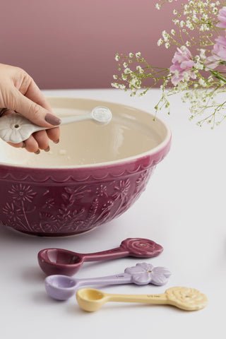 Mixing cake batter in Mason Cash bowl illustrating easy mixing and stable base