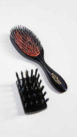 Mason Pearson brush with included nylon cleaning brush demonstrating easy maintenance and long-term care