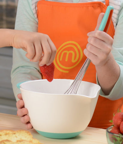 MasterChef Junior citrus juicer in use with child squeezing for fresh juice and learning