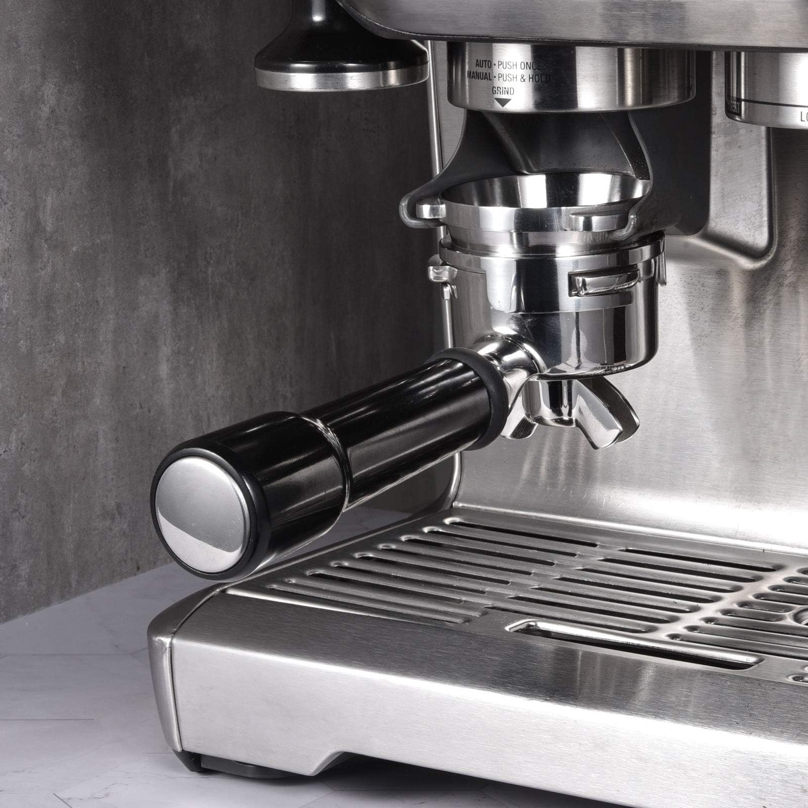 MATOW funnel in use under grinder showing hands-free, clean grinding