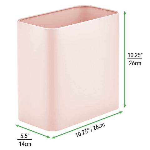 mDesign bin next to toilet demonstrating compact placement and tidy storage