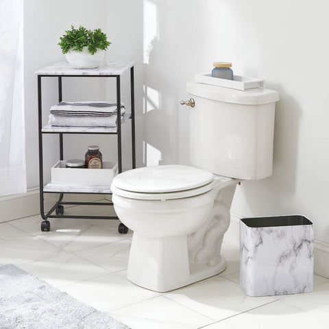 mDesign bin placed next to sink demonstrating bathroom coordination and tidy appearance