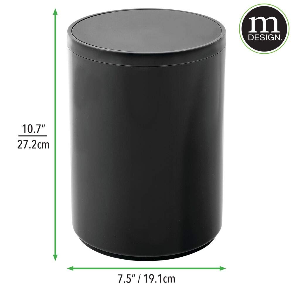 mDesign scale with hand demonstrating lightweight portability
