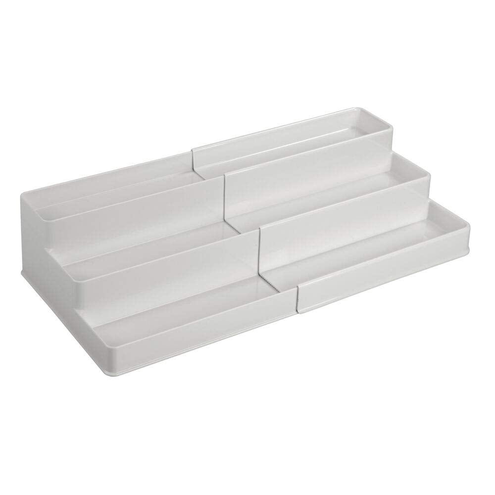 mDesign next to hand showing scale and compact footprint advantage