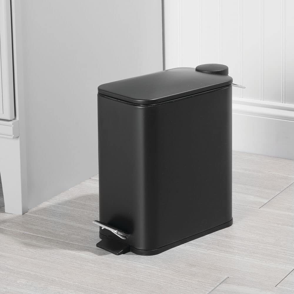 mDesign slim trash can with lid open and foot pedal in use for hands-free disposal