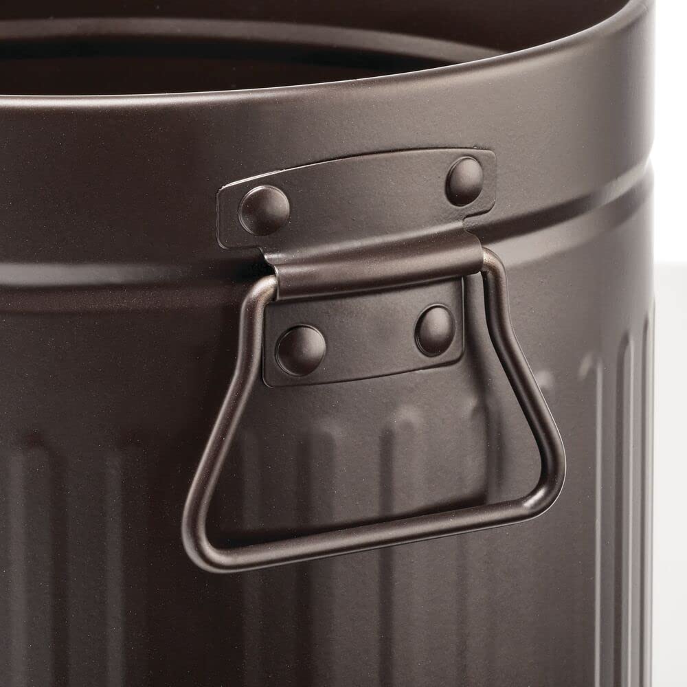 mDesign handles being used to carry the bin easily for quick emptying